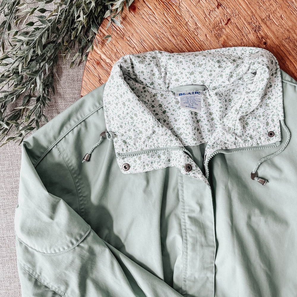 sage green raincoat